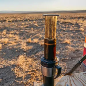 Using two hands, quickly flip the Aeropress on top of your mug.