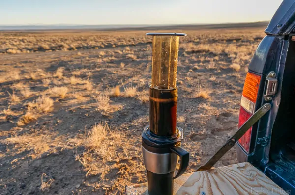 Using two hands, quickly flip the Aeropress on top of your mug.