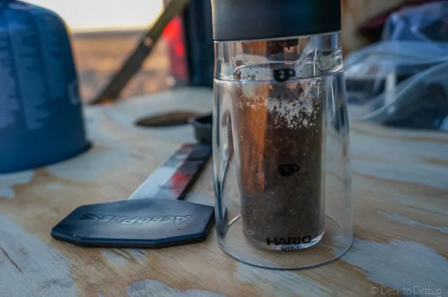 I grind up to the one cup mark. I use a hand cranked burr grinder, the Hario Mini Mill Slim Grind. A perfect companion for the Aeropress. The Best Camping Coffee Maker & How to Make Coffee While Camping