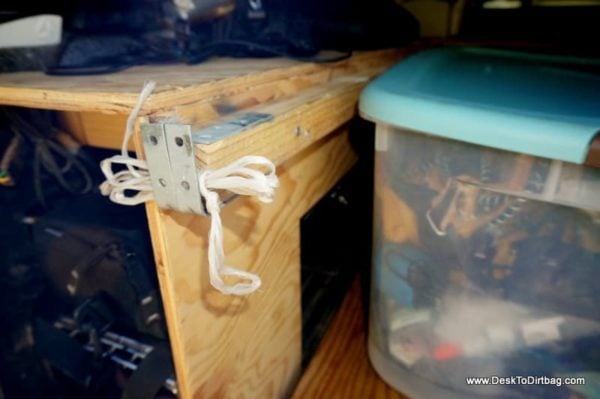 Another view of the L Brackets which kept the platform from sliding at all--simply attached to the underside of the 2x2. The string was to run between the L Brackets on both sides so I could remove the platform from under the boxes while keeping the boxes from sliding out with it.