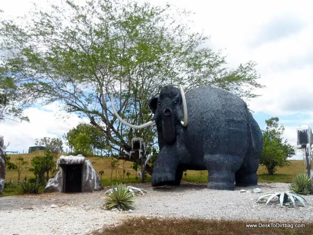 One of the strange plastic plastic dinosaurs that dot the landscape.