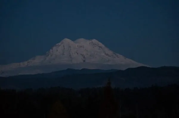 The three peaks of Mount Rainier viewed from the west.