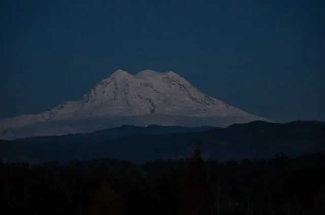 The three peaks of Mount Rainier viewed from the west.