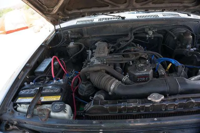 Here you can see under the hood of my 1991 Toyota Pickup and how tight the engine compartment is for a dual battery setup.