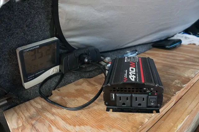 The three prong cigarette lighter setup and inverter that I have installed in the back of my truck canopy for electronics.