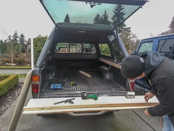 Attach the 2x4 to the side of the truck