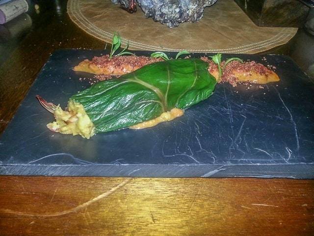 A shrimp tamale and hogao.