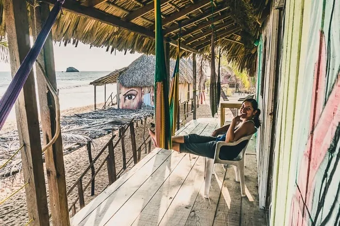 Andrea sitting back in our cabana overlooking the ocean in Zipolite, the coolest Mexico hippie beach town.