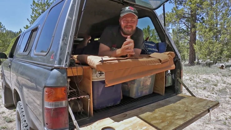 Using the elevated truck bed sleeping platform with gear storage below