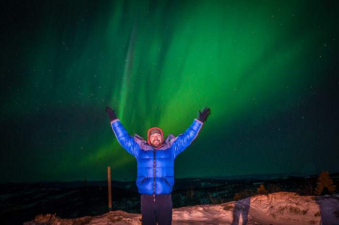 Me at Skiland Lodge with the Northern Lights above.
