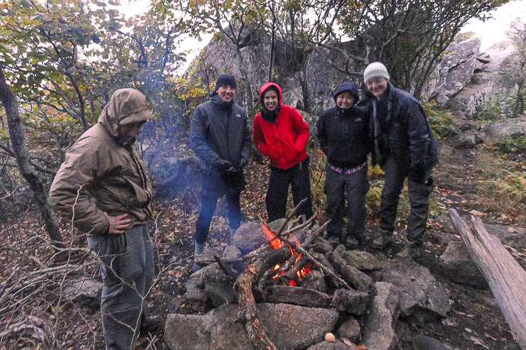 Hanging out by the fire on an overnight backpacking trip. Day Hike Essentials
