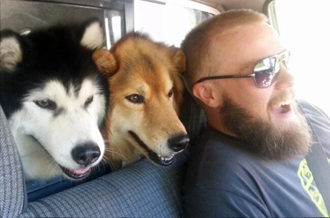 Ryan on the road to go backpacking with his buddy and two dogs.